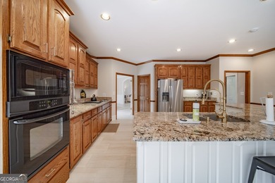 Tucked within the sought-after Estates section of Horseshoe Bend on Horseshoe Bend Country Club in Georgia - for sale on GolfHomes.com, golf home, golf lot