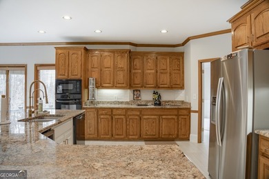 Tucked within the sought-after Estates section of Horseshoe Bend on Horseshoe Bend Country Club in Georgia - for sale on GolfHomes.com, golf home, golf lot