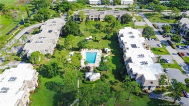 Enjoy courtyard views from this renovated, 2cd floor condo in on Martin County Golf Course in Florida - for sale on GolfHomes.com, golf home, golf lot