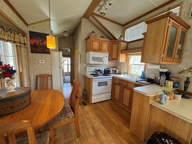 You have to check out this beautiful park model on a corner lot on Captains Cove Golf and Yacht Club in Virginia - for sale on GolfHomes.com, golf home, golf lot