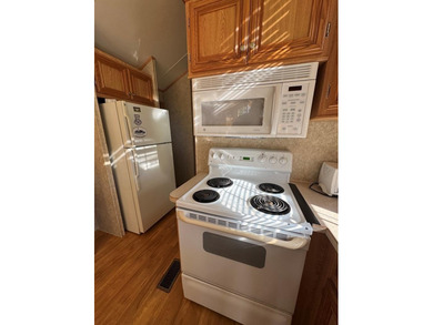 You have to check out this beautiful park model on a corner lot on Captains Cove Golf and Yacht Club in Virginia - for sale on GolfHomes.com, golf home, golf lot