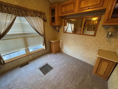 You have to check out this beautiful park model on a corner lot on Captains Cove Golf and Yacht Club in Virginia - for sale on GolfHomes.com, golf home, golf lot