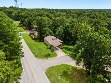 Tucked into the trees just minutes from Bentonville, this on Bella Vista - Metfield Golf Complex and Country Club in Arkansas - for sale on GolfHomes.com, golf home, golf lot