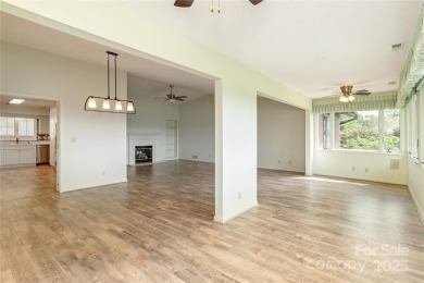 Million Dollar Views and morning sunrises from behind the on Hendersonville Country Club in North Carolina - for sale on GolfHomes.com, golf home, golf lot