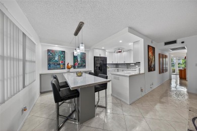 FIRST FLOOR -- COMPLETELY RENOVATED LAKEFRONT HOME that will on Wynmoor Golf Course in Florida - for sale on GolfHomes.com, golf home, golf lot
