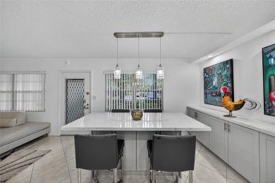 FIRST FLOOR -- COMPLETELY RENOVATED LAKEFRONT HOME that will on Wynmoor Golf Course in Florida - for sale on GolfHomes.com, golf home, golf lot