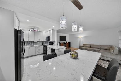 FIRST FLOOR -- COMPLETELY RENOVATED LAKEFRONT HOME that will on Wynmoor Golf Course in Florida - for sale on GolfHomes.com, golf home, golf lot