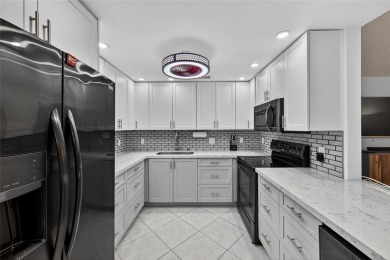 FIRST FLOOR -- COMPLETELY RENOVATED LAKEFRONT HOME that will on Wynmoor Golf Course in Florida - for sale on GolfHomes.com, golf home, golf lot
