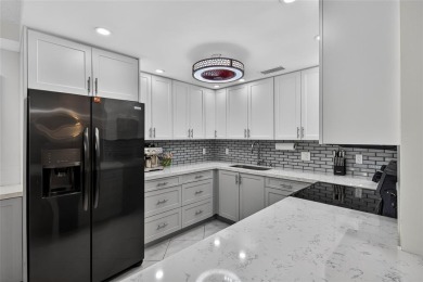 FIRST FLOOR -- COMPLETELY RENOVATED LAKEFRONT HOME that will on Wynmoor Golf Course in Florida - for sale on GolfHomes.com, golf home, golf lot