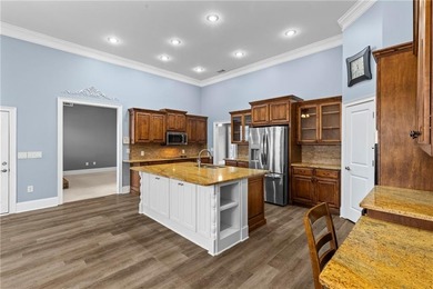 Discover elegance and comfort in this stunning home nestled in on Traditions of Braselton Golf Club in Georgia - for sale on GolfHomes.com, golf home, golf lot