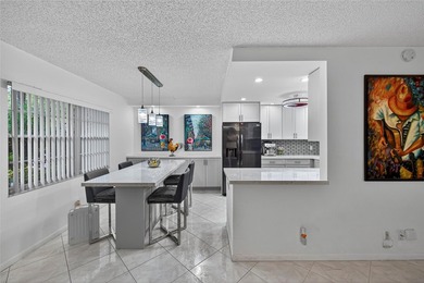 First-floor, fully renovated lakefront residence designed for on Wynmoor Golf Course in Florida - for sale on GolfHomes.com, golf home, golf lot