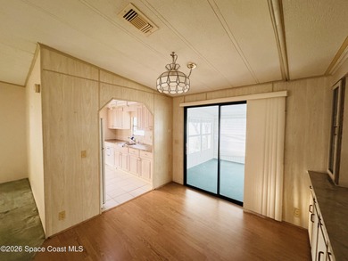 Dont miss this 2-bedroom, 2-bath mobile home featuring a on Barefoot Bay Golf Course in Florida - for sale on GolfHomes.com, golf home, golf lot