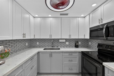 FIRST FLOOR -- COMPLETELY RENOVATED LAKEFRONT HOME that will on Wynmoor Golf Course in Florida - for sale on GolfHomes.com, golf home, golf lot