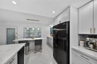 FIRST FLOOR -- COMPLETELY RENOVATED LAKEFRONT HOME that will on Wynmoor Golf Course in Florida - for sale on GolfHomes.com, golf home, golf lot