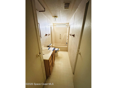 Dont miss this 2-bedroom, 2-bath mobile home featuring a on Barefoot Bay Golf Course in Florida - for sale on GolfHomes.com, golf home, golf lot