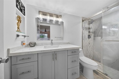 FIRST FLOOR -- COMPLETELY RENOVATED LAKEFRONT HOME that will on Wynmoor Golf Course in Florida - for sale on GolfHomes.com, golf home, golf lot