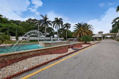FIRST FLOOR -- COMPLETELY RENOVATED LAKEFRONT HOME that will on Wynmoor Golf Course in Florida - for sale on GolfHomes.com, golf home, golf lot