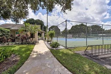 FIRST FLOOR -- COMPLETELY RENOVATED LAKEFRONT HOME that will on Wynmoor Golf Course in Florida - for sale on GolfHomes.com, golf home, golf lot