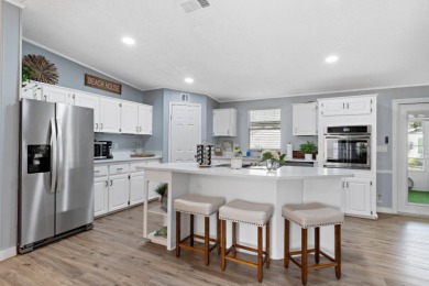 Step into this warm and welcoming 2 bed/ 2 bath completely on Spanish Lakes Fairways in Florida - for sale on GolfHomes.com, golf home, golf lot