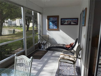1ST floor Stunning lake and fountain view from this bright and on Wynmoor Golf Course in Florida - for sale on GolfHomes.com, golf home, golf lot