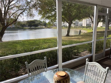 1ST floor Stunning lake and fountain view from this bright and on Wynmoor Golf Course in Florida - for sale on GolfHomes.com, golf home, golf lot