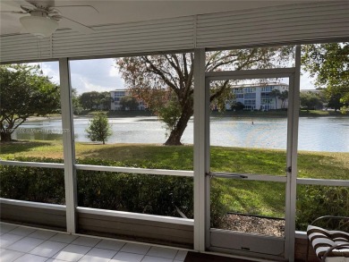 1ST floor Stunning lake and fountain view from this bright and on Wynmoor Golf Course in Florida - for sale on GolfHomes.com, golf home, golf lot