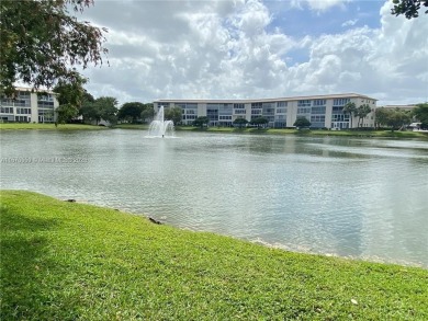 1ST floor Stunning lake and fountain view from this bright and on Wynmoor Golf Course in Florida - for sale on GolfHomes.com, golf home, golf lot