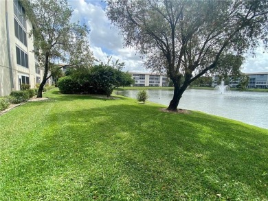 1ST floor Stunning lake and fountain view from this bright and on Wynmoor Golf Course in Florida - for sale on GolfHomes.com, golf home, golf lot