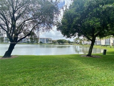 1ST floor Stunning lake and fountain view from this bright and on Wynmoor Golf Course in Florida - for sale on GolfHomes.com, golf home, golf lot
