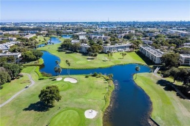 1ST floor Stunning lake and fountain view from this bright and on Wynmoor Golf Course in Florida - for sale on GolfHomes.com, golf home, golf lot