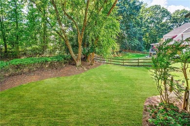 Welcome to a perfectly situated home in the heart of Windward on The Golf Club of Georgia in Georgia - for sale on GolfHomes.com, golf home, golf lot