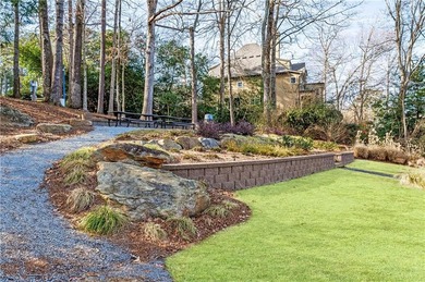 Welcome to a perfectly situated home in the heart of Windward on The Golf Club of Georgia in Georgia - for sale on GolfHomes.com, golf home, golf lot