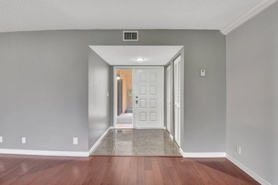 Perfectly located first floor condo residence with long views of on Bocaire Country Club in Florida - for sale on GolfHomes.com, golf home, golf lot