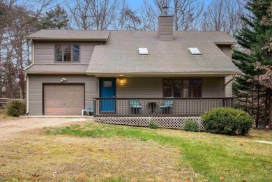 Cozy, contemporary, and full of charm--this mountain home in on Woodstone Meadows Golf Course At Massanutten in Virginia - for sale on GolfHomes.com, golf home, golf lot