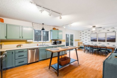 Cozy, contemporary, and full of charm--this mountain home in on Woodstone Meadows Golf Course At Massanutten in Virginia - for sale on GolfHomes.com, golf home, golf lot