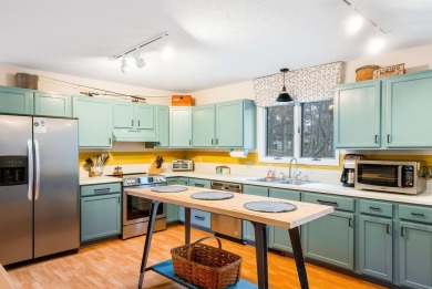 Cozy, contemporary, and full of charm--this mountain home in on Woodstone Meadows Golf Course At Massanutten in Virginia - for sale on GolfHomes.com, golf home, golf lot