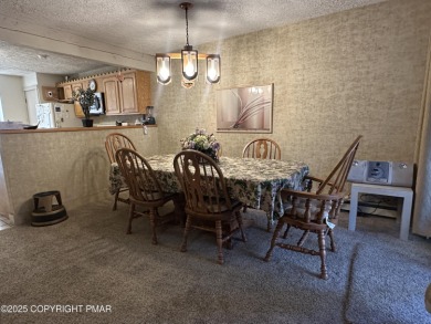 Welcome to 844 Crest Pine Lane - a charming 3-bedroom, 2.5 bath on Pinecrest Lake Golf and Country Club in Pennsylvania - for sale on GolfHomes.com, golf home, golf lot