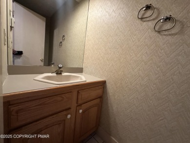 Welcome to 844 Crest Pine Lane - a charming 3-bedroom, 2.5 bath on Pinecrest Lake Golf and Country Club in Pennsylvania - for sale on GolfHomes.com, golf home, golf lot