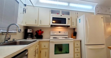 MUST SEE! Beautifully UPDATED 3rd FLOOR 2/2 PENTHOUSE condo in on Sunrise Lakes Phase IV Golf Course in Florida - for sale on GolfHomes.com, golf home, golf lot