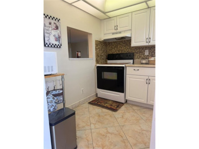 Wonderful well kept condo fully furnished and move in ready on Sunrise Lakes Phase III in Florida - for sale on GolfHomes.com, golf home, golf lot