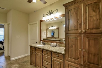 Welcome to this charming 4-bedroom, 2-bath home nestled within on Harbor Lakes Golf Club in Texas - for sale on GolfHomes.com, golf home, golf lot