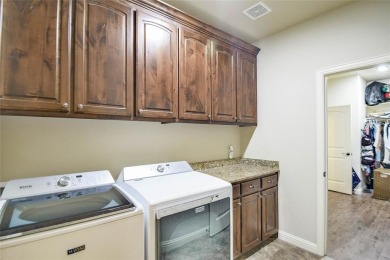 Welcome to this charming 4-bedroom, 2-bath home nestled within on Harbor Lakes Golf Club in Texas - for sale on GolfHomes.com, golf home, golf lot