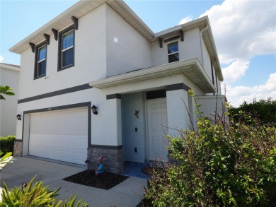 This spacious two story home all-concrete block construction has on Esplanade Golf and Country at Lakewood Ranch in Florida - for sale on GolfHomes.com, golf home, golf lot