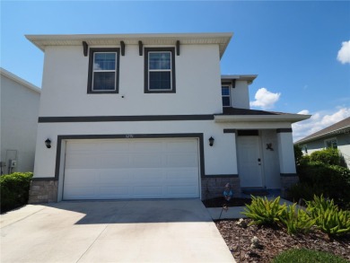This spacious two story home all-concrete block construction has on Esplanade Golf and Country at Lakewood Ranch in Florida - for sale on GolfHomes.com, golf home, golf lot