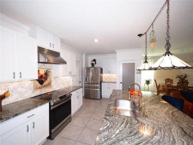 This spacious two story home all-concrete block construction has on Esplanade Golf and Country at Lakewood Ranch in Florida - for sale on GolfHomes.com, golf home, golf lot