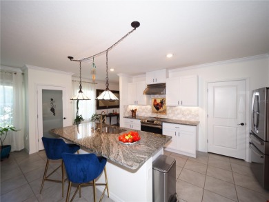 This spacious two story home all-concrete block construction has on Esplanade Golf and Country at Lakewood Ranch in Florida - for sale on GolfHomes.com, golf home, golf lot