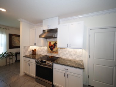 This spacious two story home all-concrete block construction has on Esplanade Golf and Country at Lakewood Ranch in Florida - for sale on GolfHomes.com, golf home, golf lot