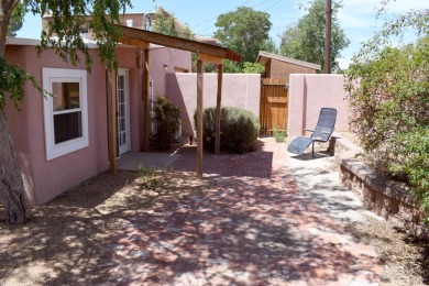 Charming North Campus location! This pueblo style  home has on North Course - University of New Mexico  in New Mexico - for sale on GolfHomes.com, golf home, golf lot