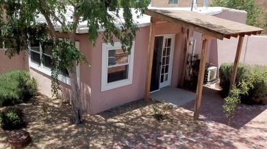 Charming North Campus location! This pueblo style  home has on North Course - University of New Mexico  in New Mexico - for sale on GolfHomes.com, golf home, golf lot