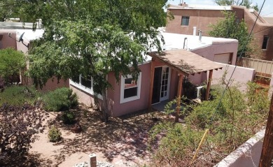 Charming North Campus location! This pueblo style  home has on North Course - University of New Mexico  in New Mexico - for sale on GolfHomes.com, golf home, golf lot